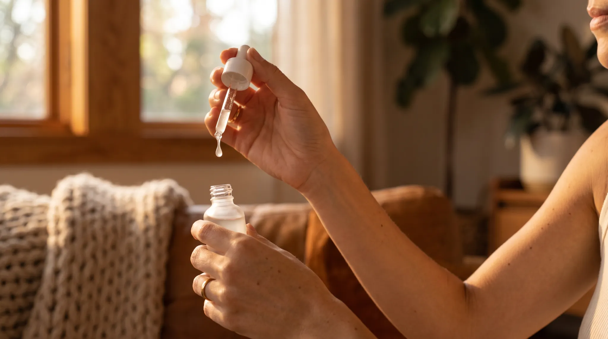 Avery holding a dropper bottle to demonstrate serum texture