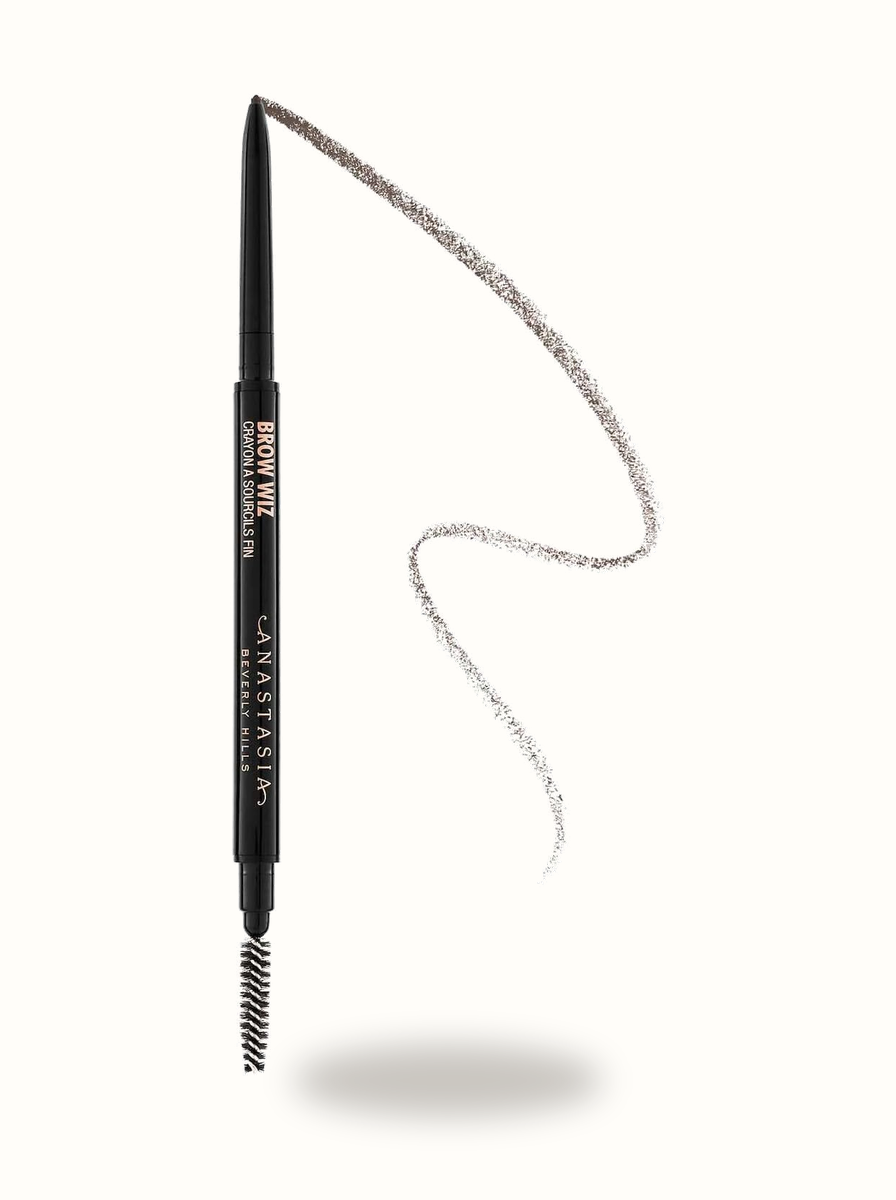 Anastasia Beverly Hills Brow Wiz pencil showing micro-tip, spoolie, and formula swatch line on warm porcelain background
