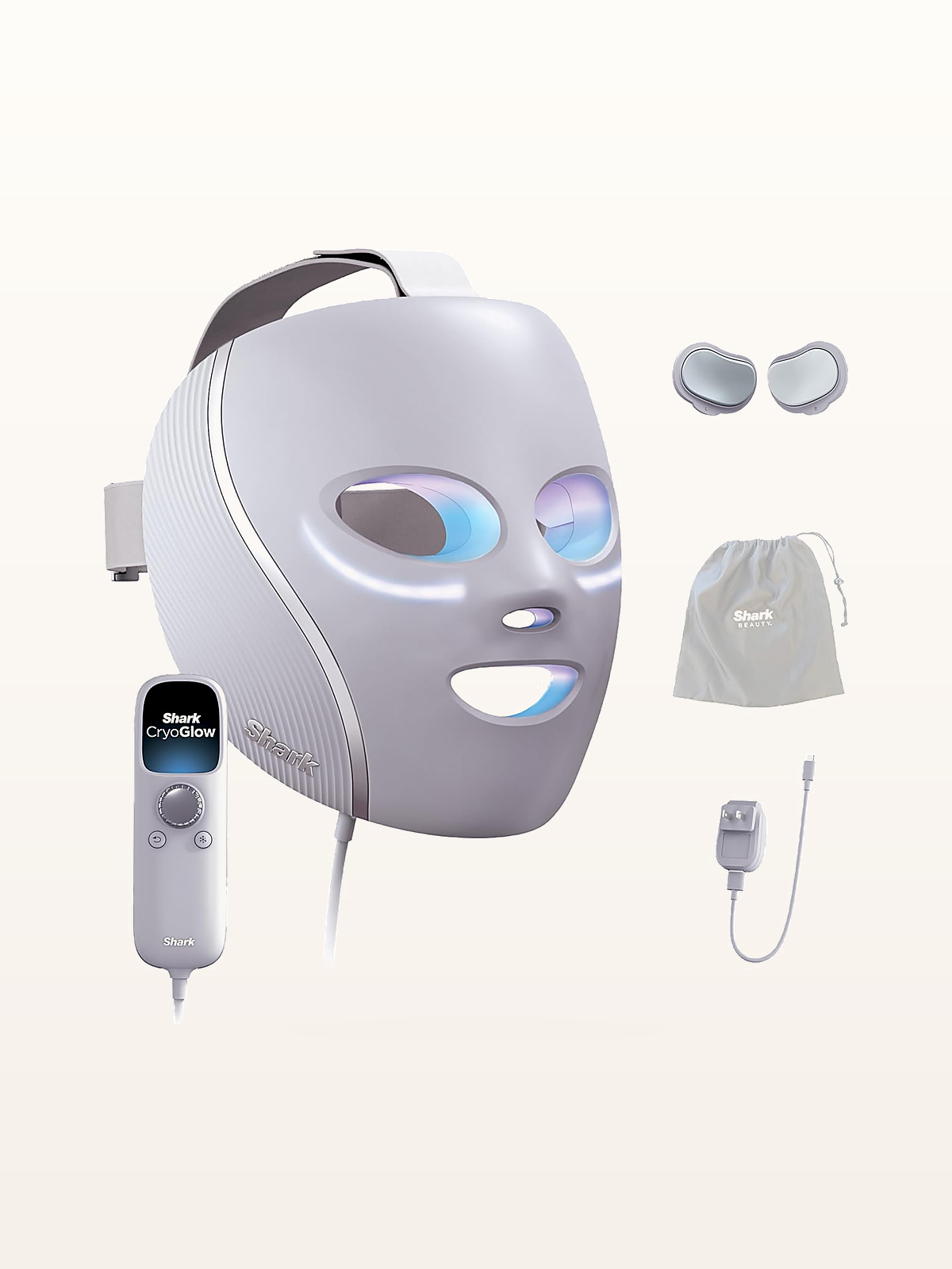 Shark CryoGlow Under-Eye Cooling & LED Mask clinical hardware on warm studio stage