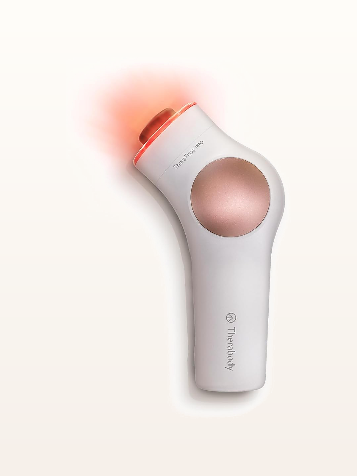 TheraFace PRO 8-in-1 Facial Health Device clinical hardware on warm studio stage
