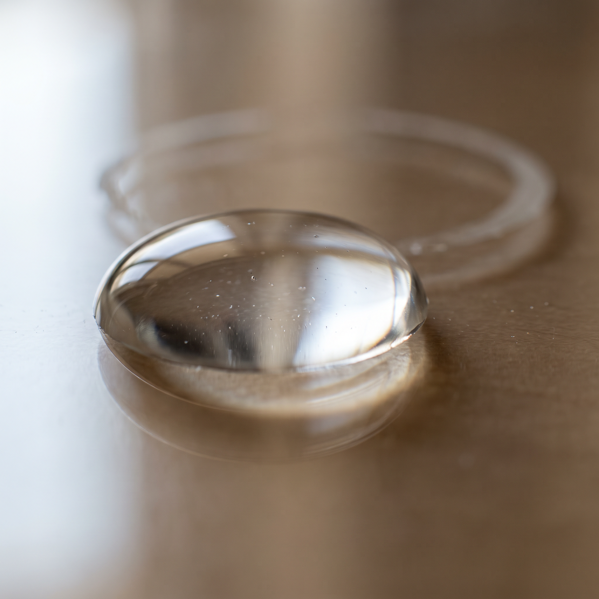 Macro view of fine light-diffusing cosmetic powder spheres used in blurring primers