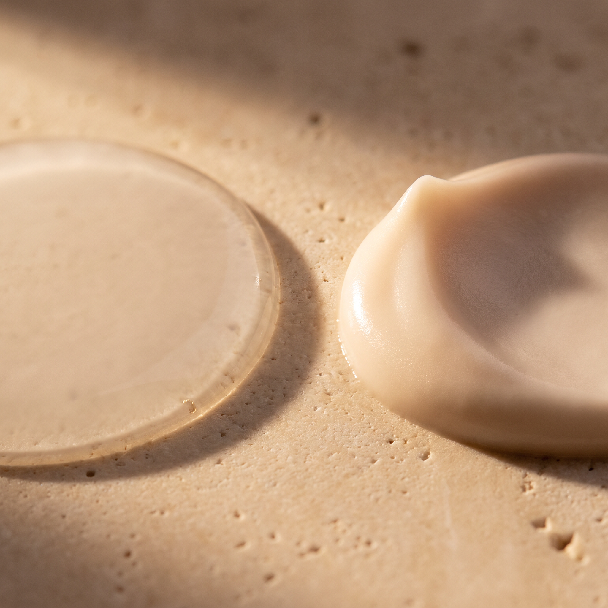 Macro close-up of translucent water-based gel primer texture on a white surface
